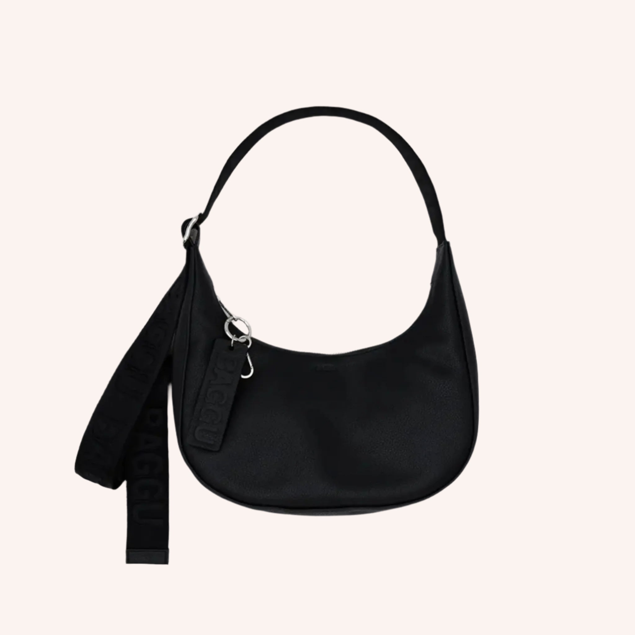 A black leather crescent bag handbag with an adjustable strap. 