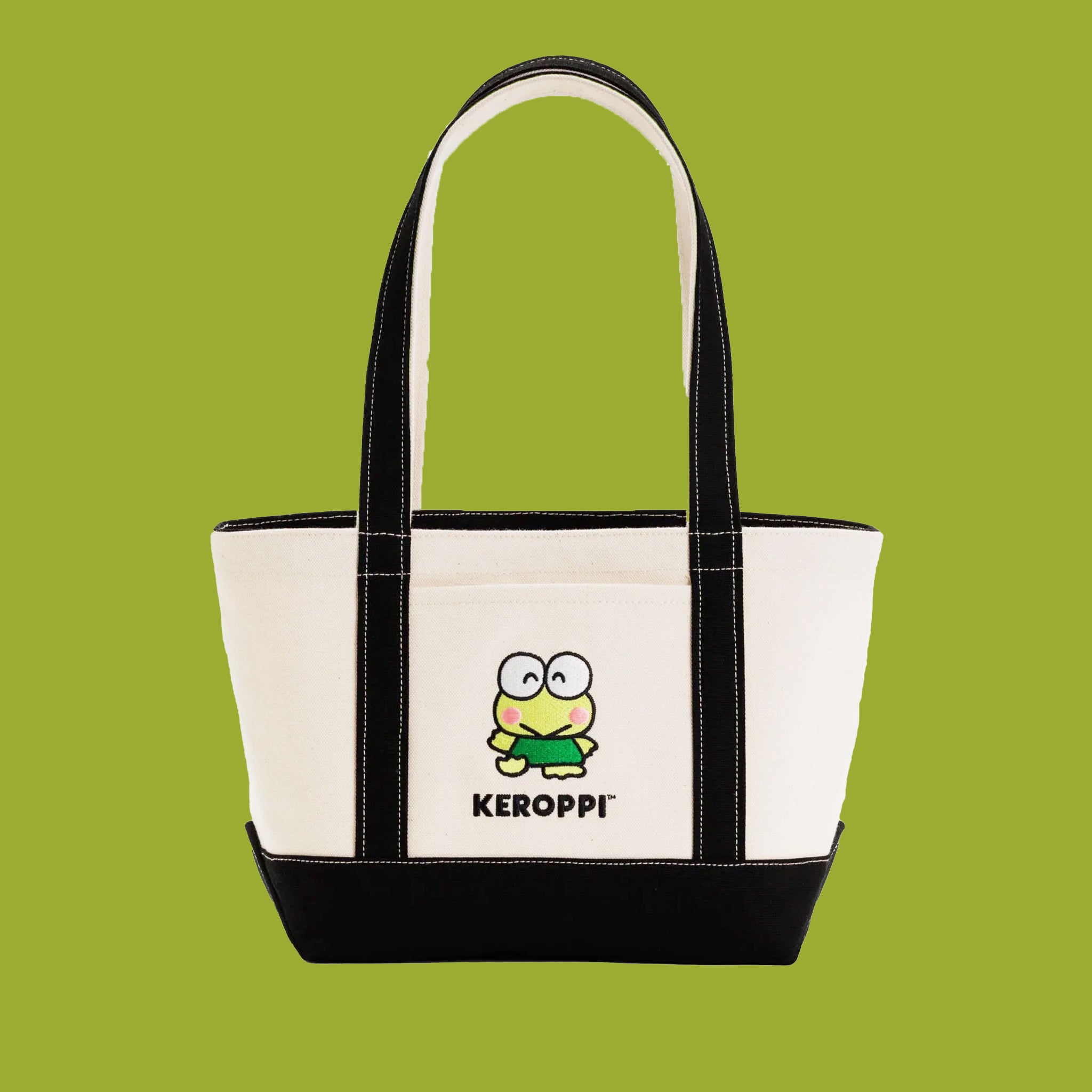 On a light green background is a black and ivory tote bag with an embroidered Keroppi on the front.