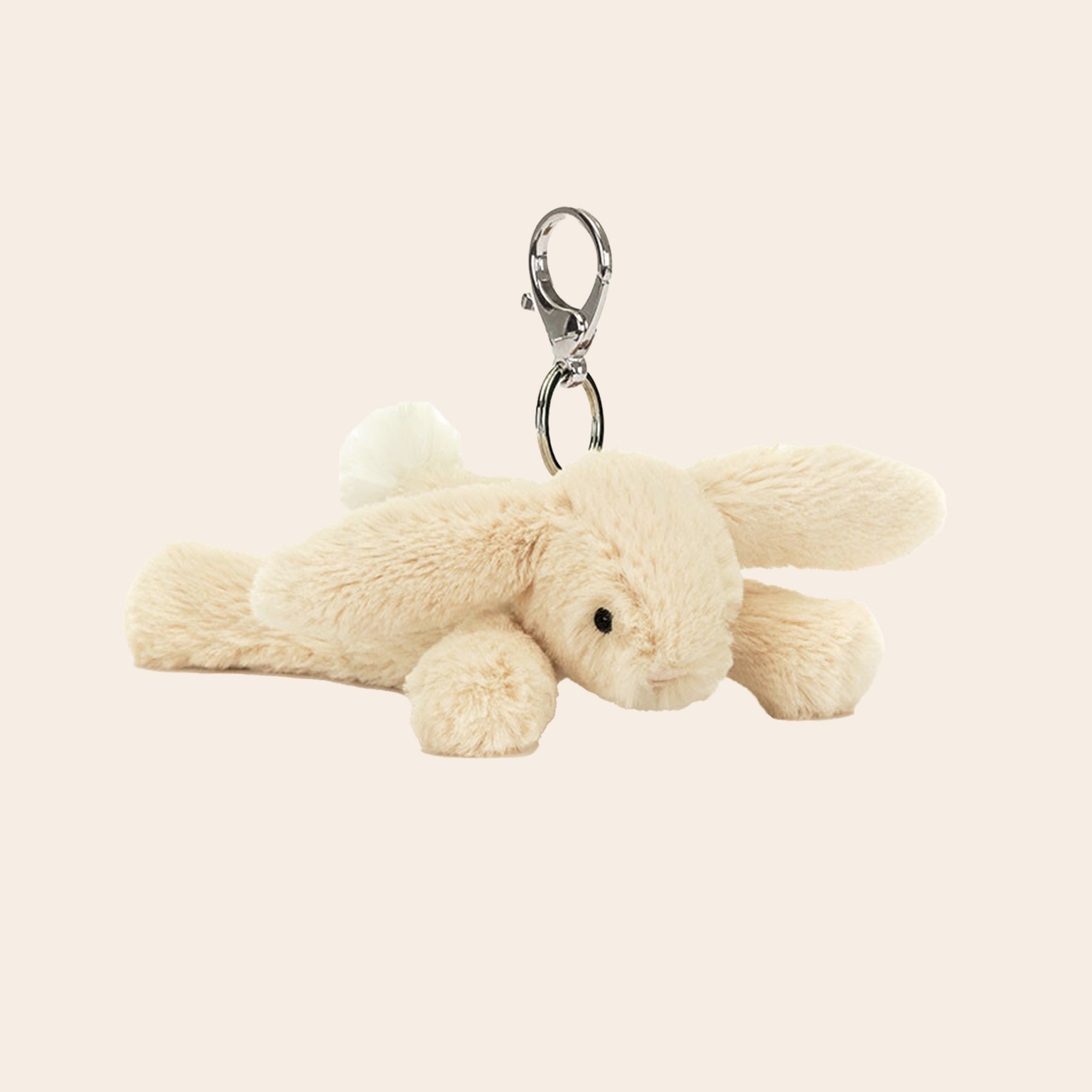 A mini bunny stuffed animal on a silver keychain. 