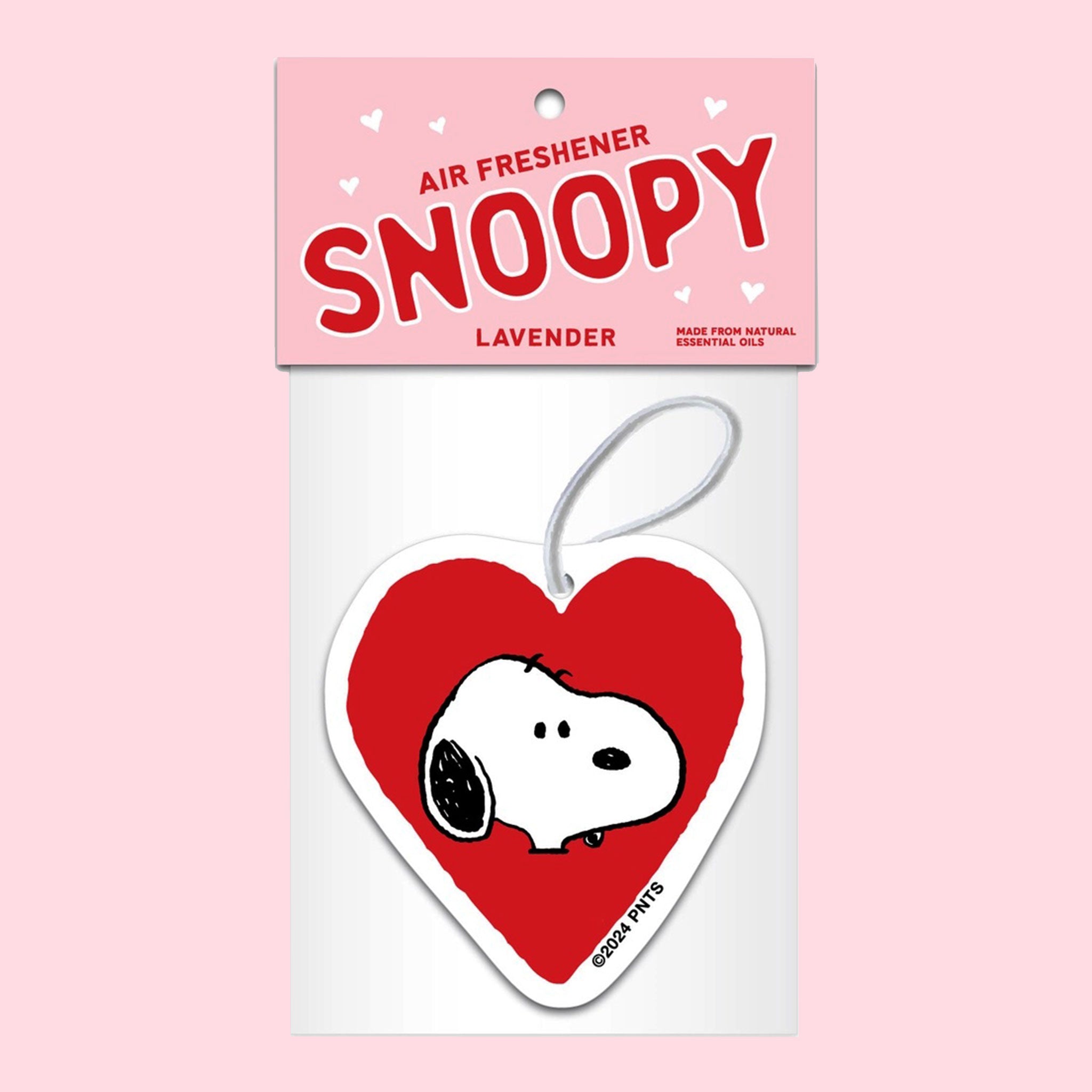 A red heart shaped air freshener with a Snoopy graphic in the center.