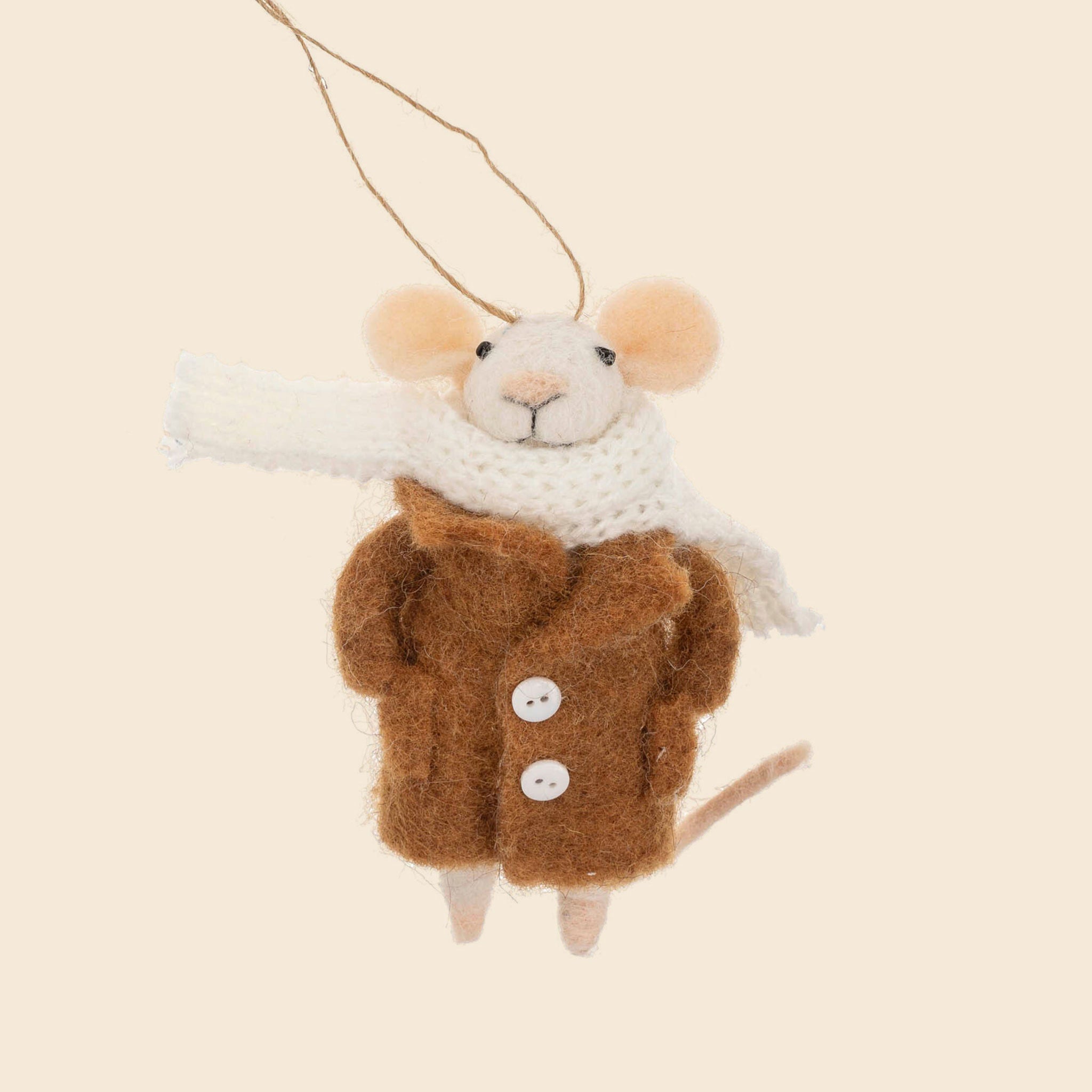 A mouse shaped ornament dressed in a large brown coat and white scarf. 