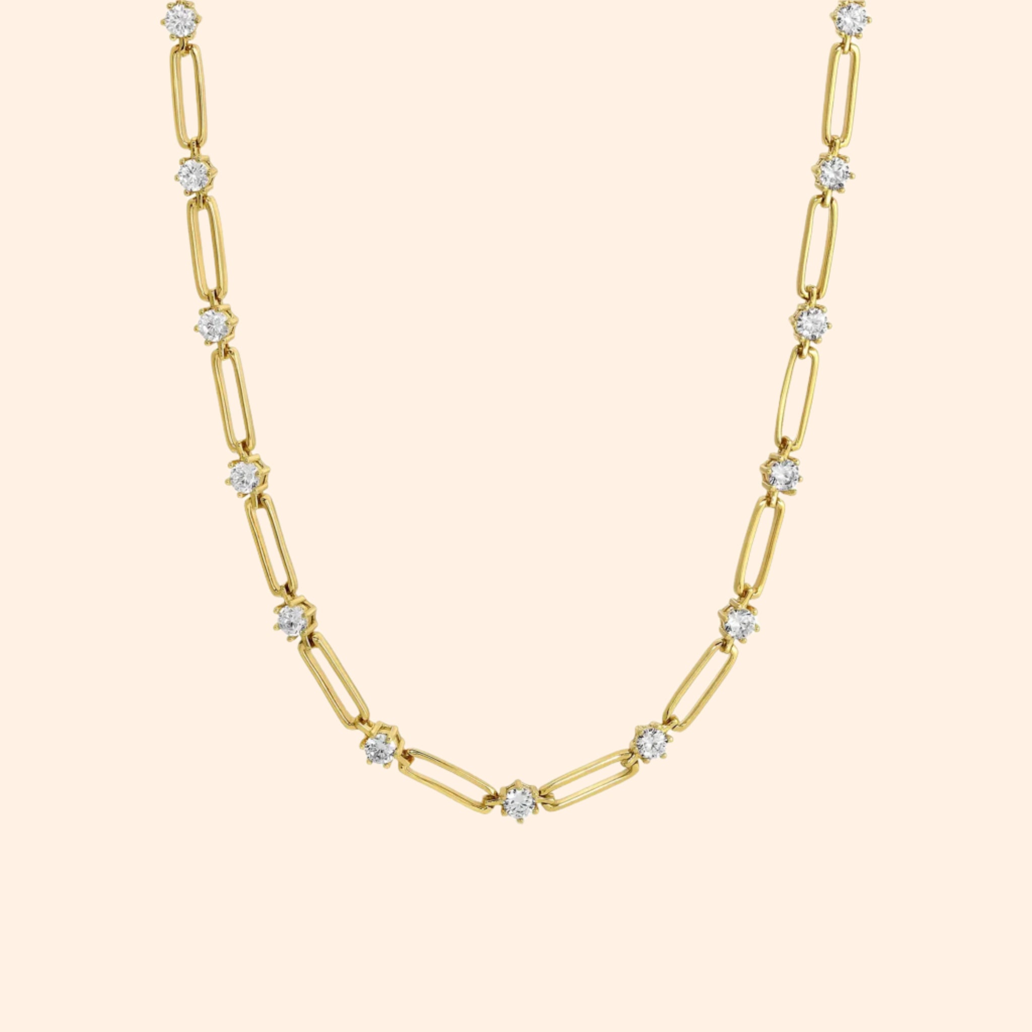 A gold chain necklace with cz stones in between each link. 