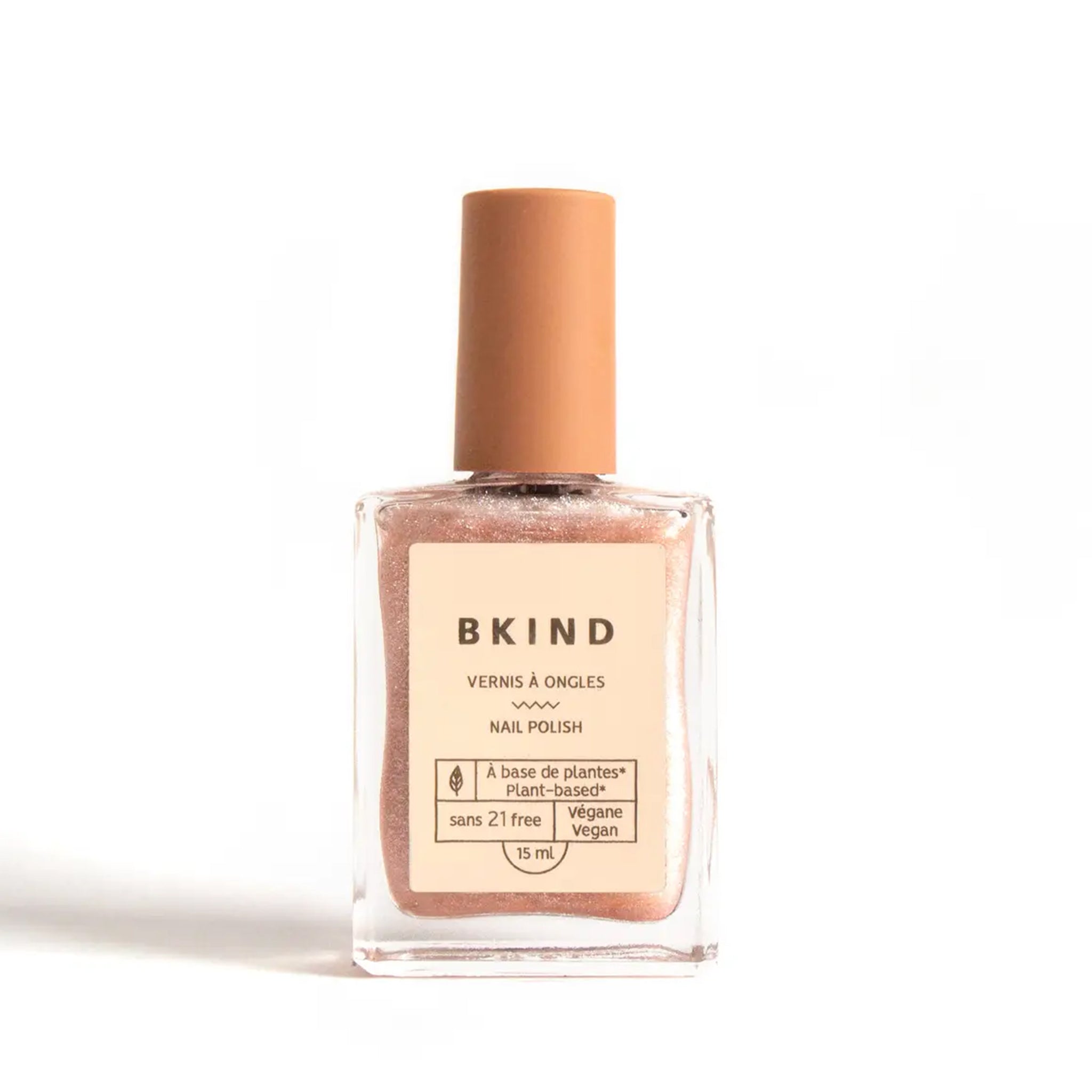 A clear, glittery nail polish with a light pink tint in a rectangle glass bottle. 