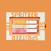 A box of three different types of sugar cubes with orange text around the edge that read, "Spritzer Set'. 