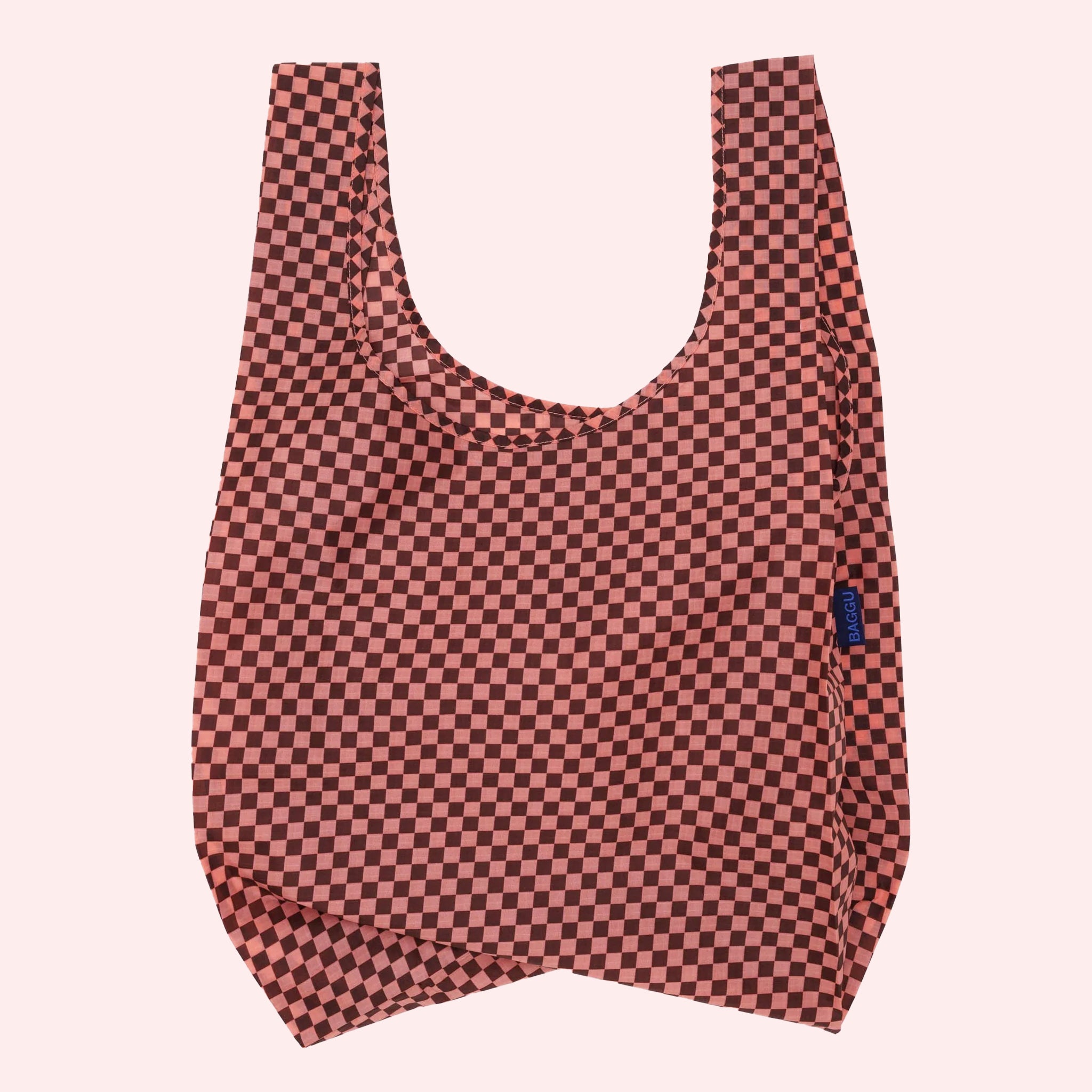 A pink and brown checker print nylon tote bag. 