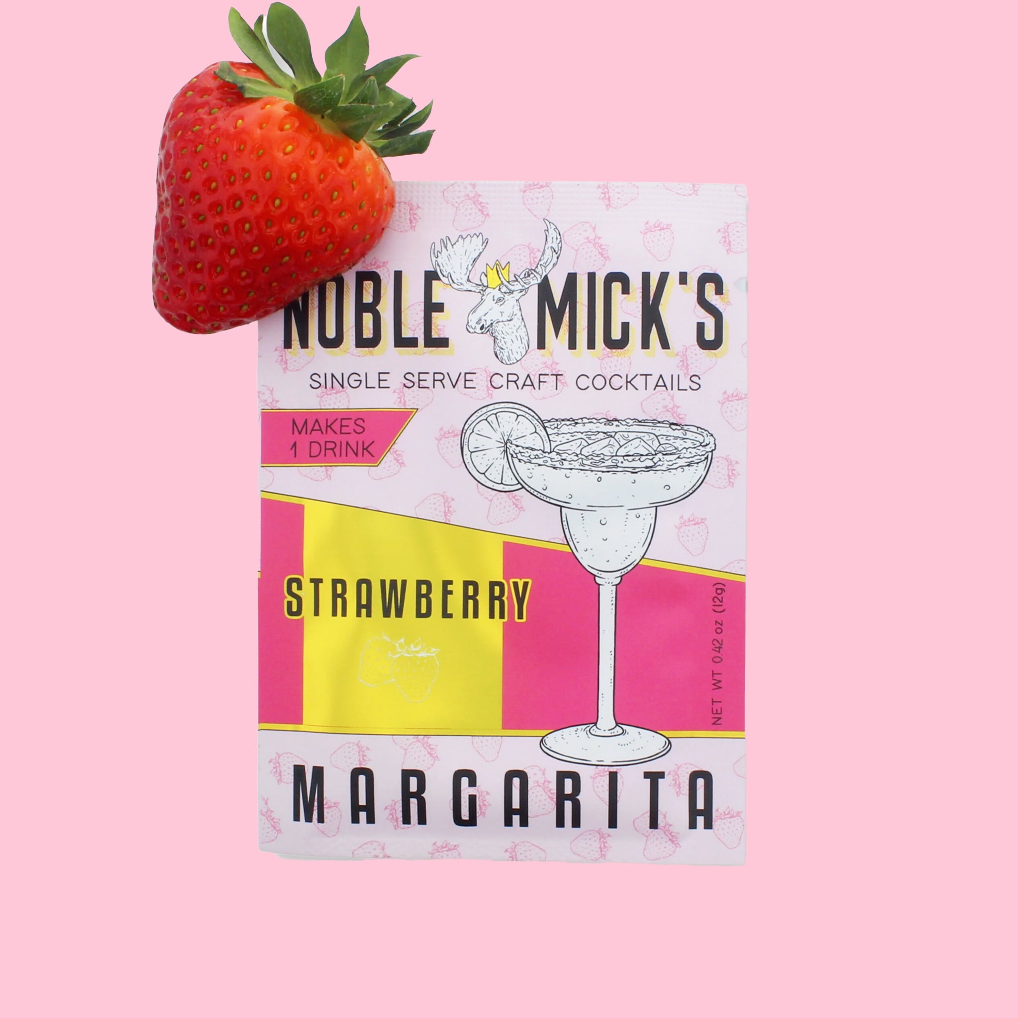 On a pink background is a hot pink and light pink packet of cocktail mix that reads, &quot;Noble Micks Single Serve Craft Cocktails Strawberry Margarita&quot;.