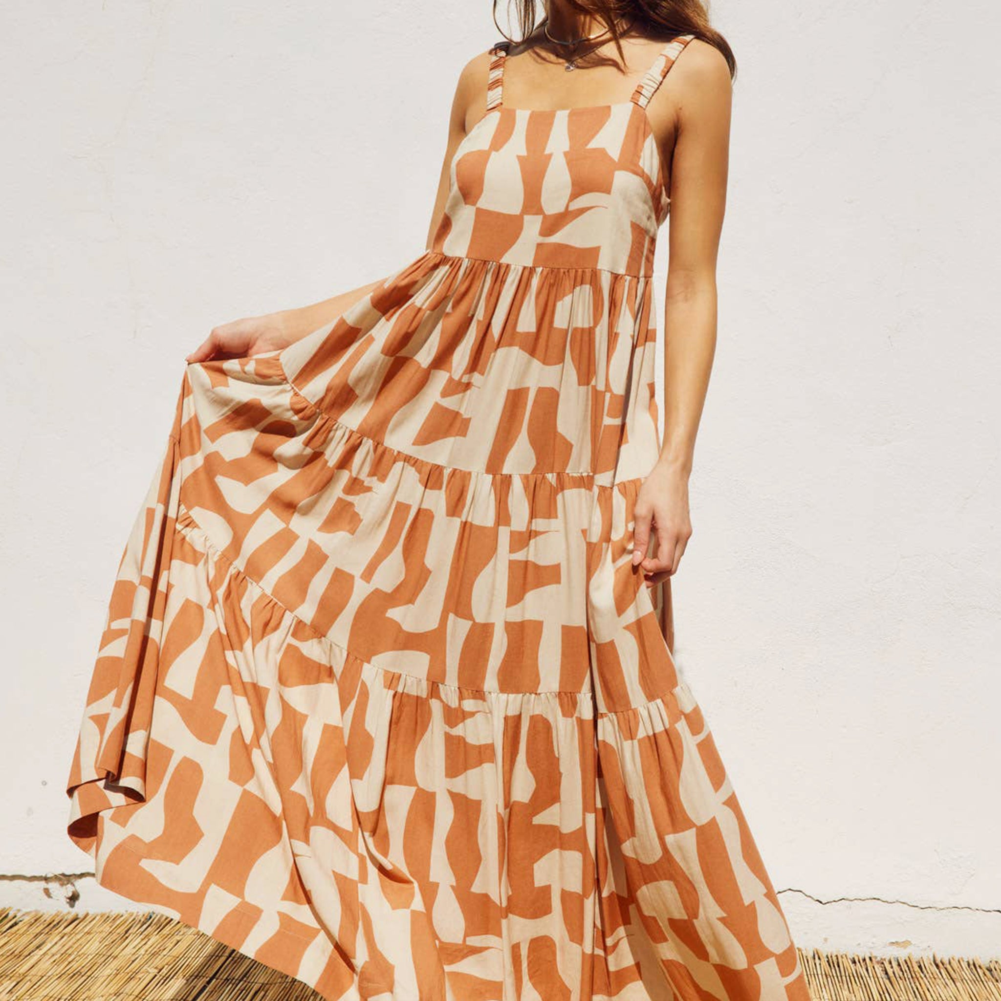 An orange and ivory geo printed maxi dress. 