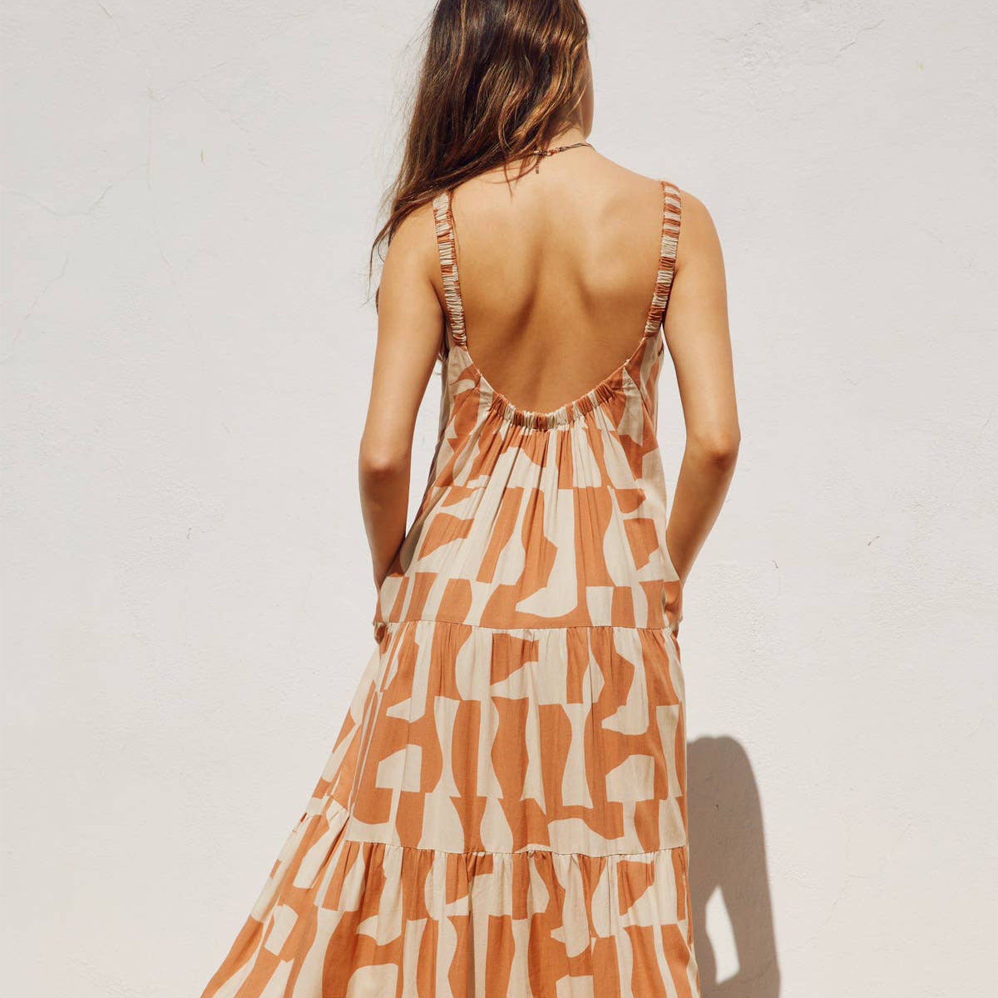 An orange and ivory geo printed maxi dress. 