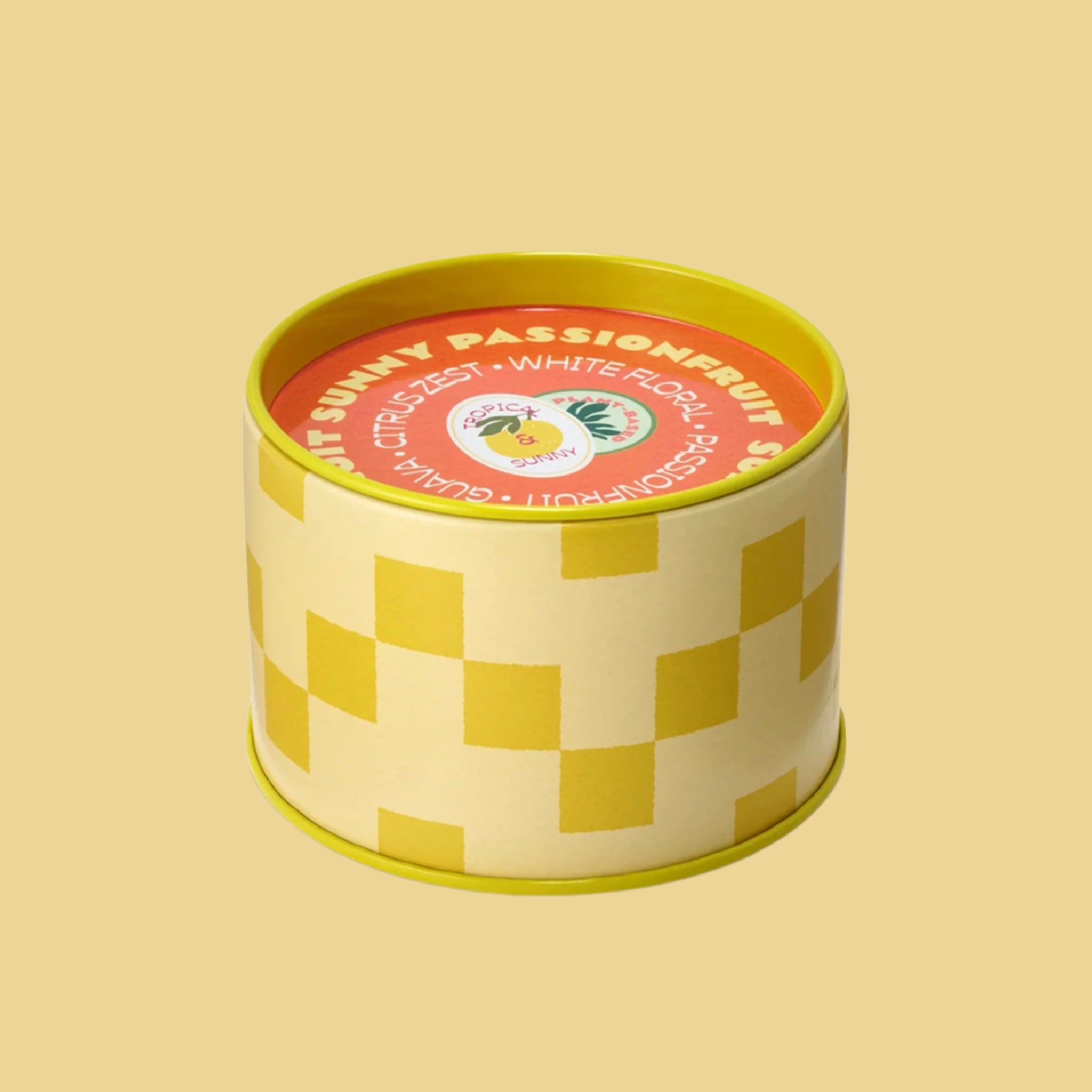 A two toned yellow and darker yellow tin candle. 