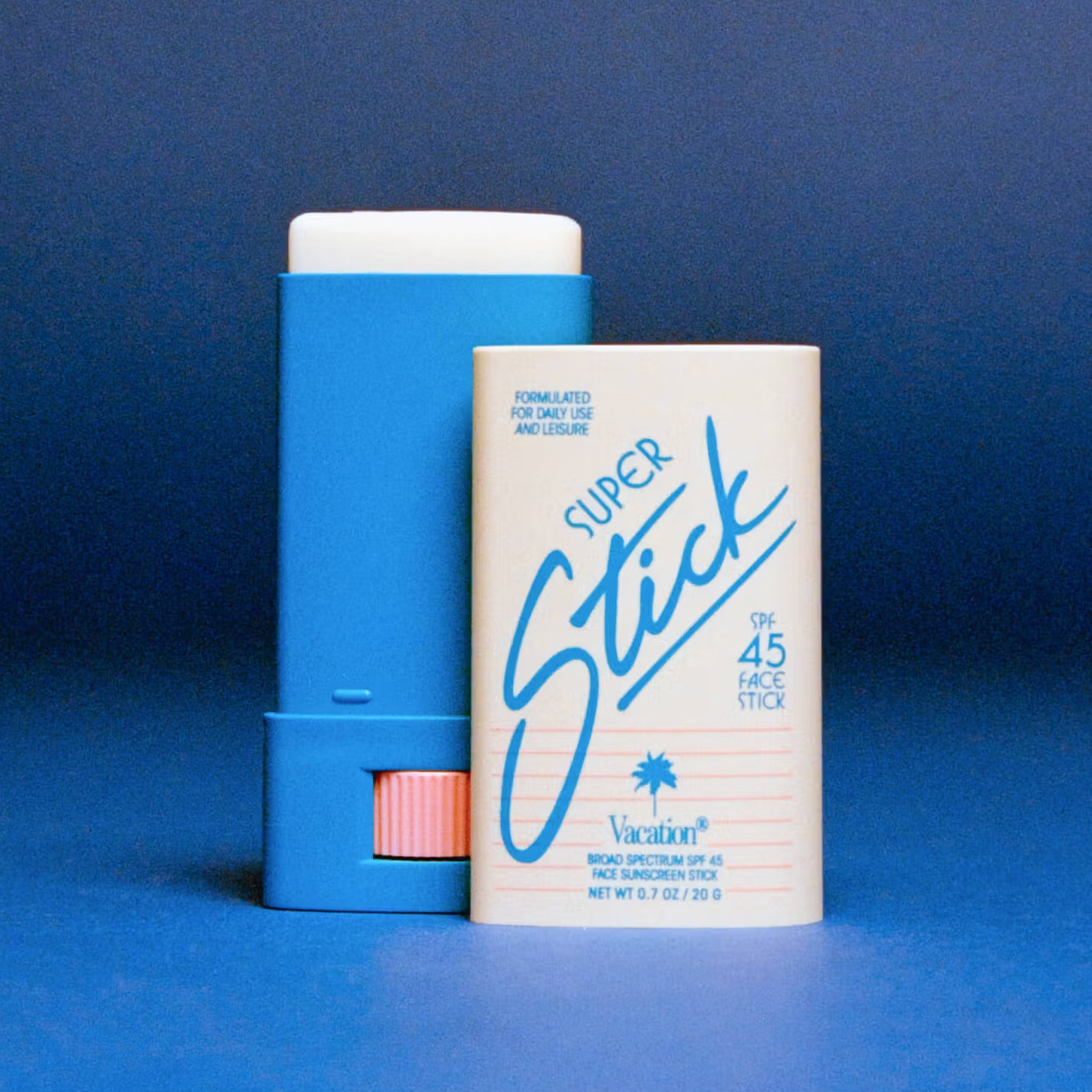 A blue and white stick sunscreen with text on the packaging that reads, 'Super Stick SPF 45 Vacation'. 