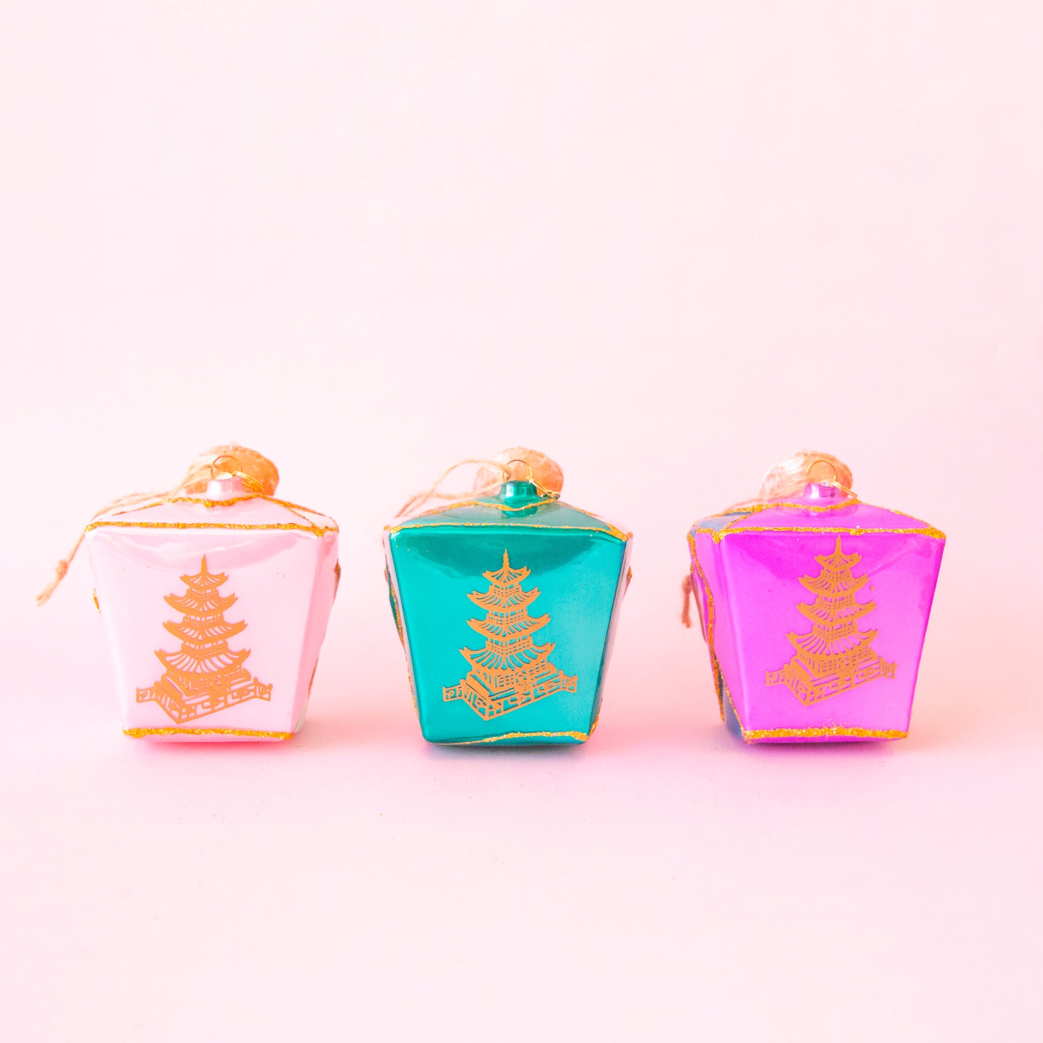 All three colors of the glass take out box ornaments in pink, blue and purple. 