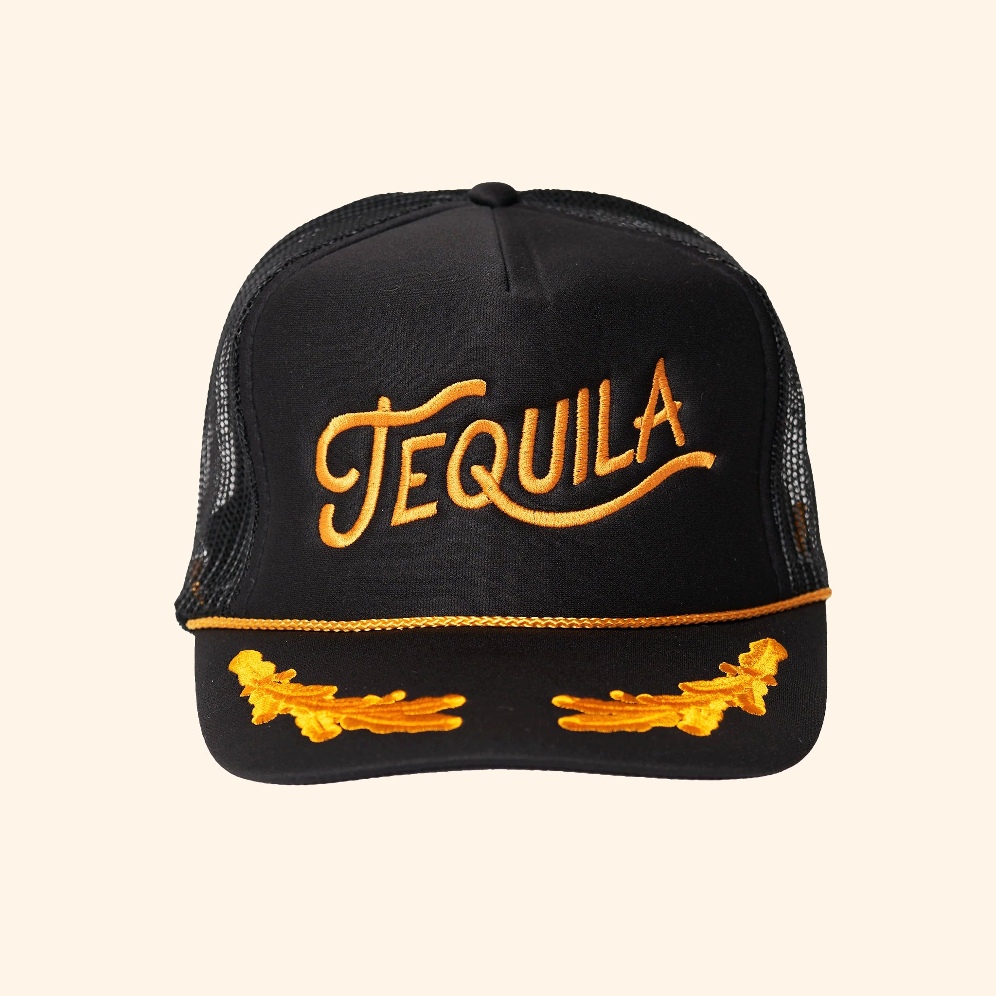 A black mesh back snapback trucker hat with gold embroidered text that reads, "Tequila". 