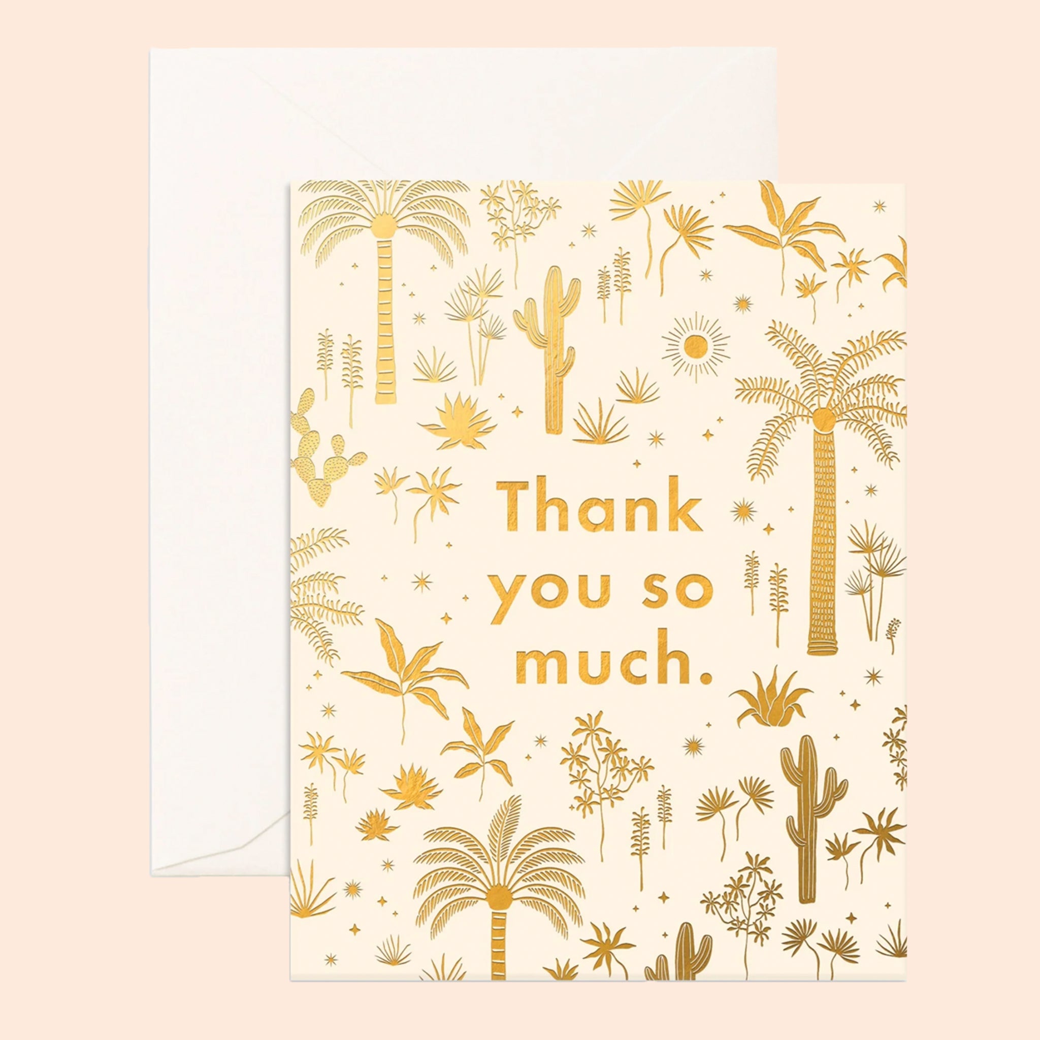 On a tan background is a gold foiled palm and desert patterned card with text in the center that reads, "Thank you so much.". 