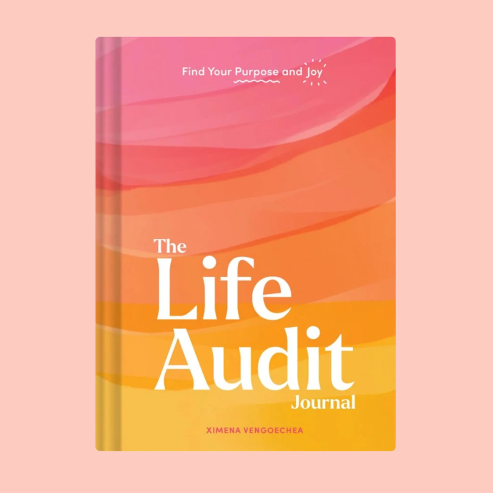 A pink, orange and yellow book cover with a white book title that reads, 'A Life Audit Journal'. 