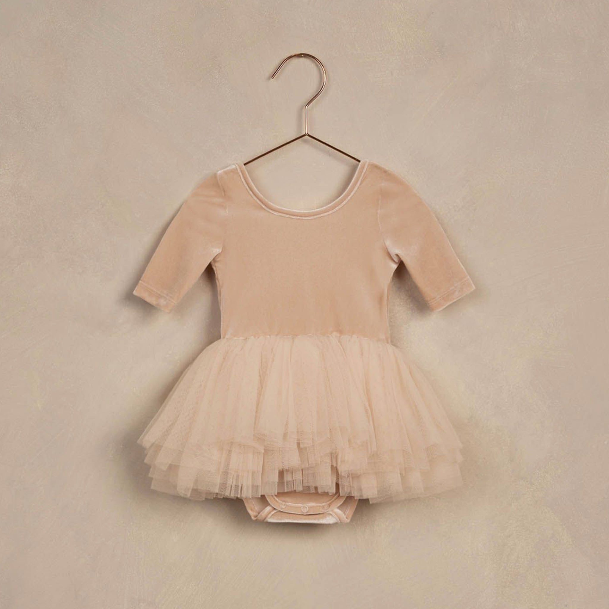 A pink tutu with a velvet leotard attached. 