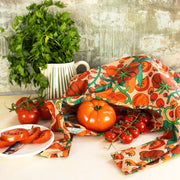 A nylon reusable bag with a red tomato print. 