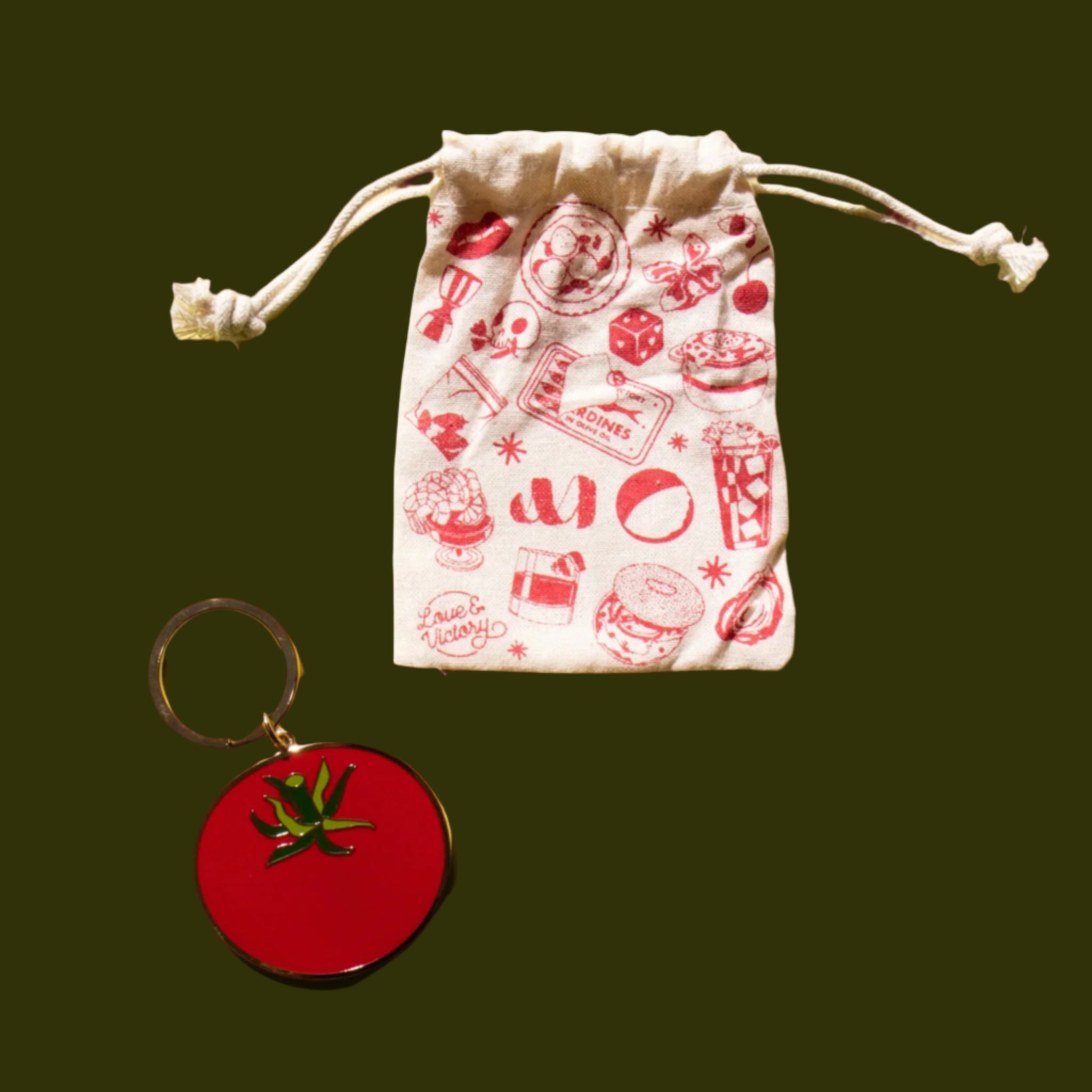 A tomato shaped enamel keychain. 