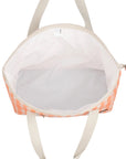 An apricot and ivory checkered print tote bag with two straps.