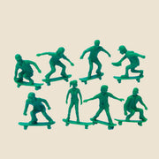 Skateboarding themed green tiny toys. 