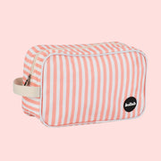 A coral and ivory striped cosmetic bag. 