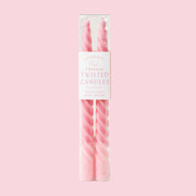 A set of two twisted pink taper candles. 