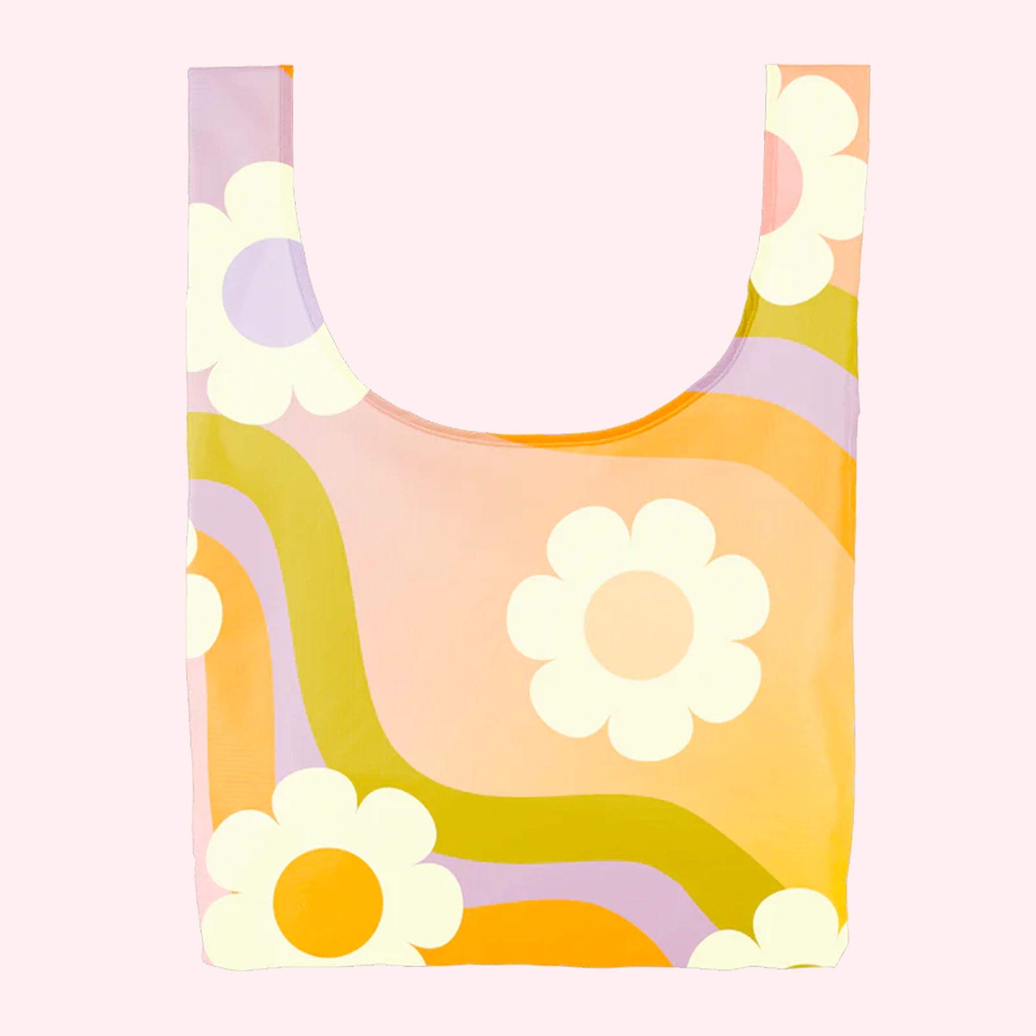 On a light pink background is a nylon reusable bag with a wavy purple, yellow and orange print with white daisies. 