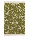 A green and ivory bamboo printed bath towel with tassel ends on both sides. 