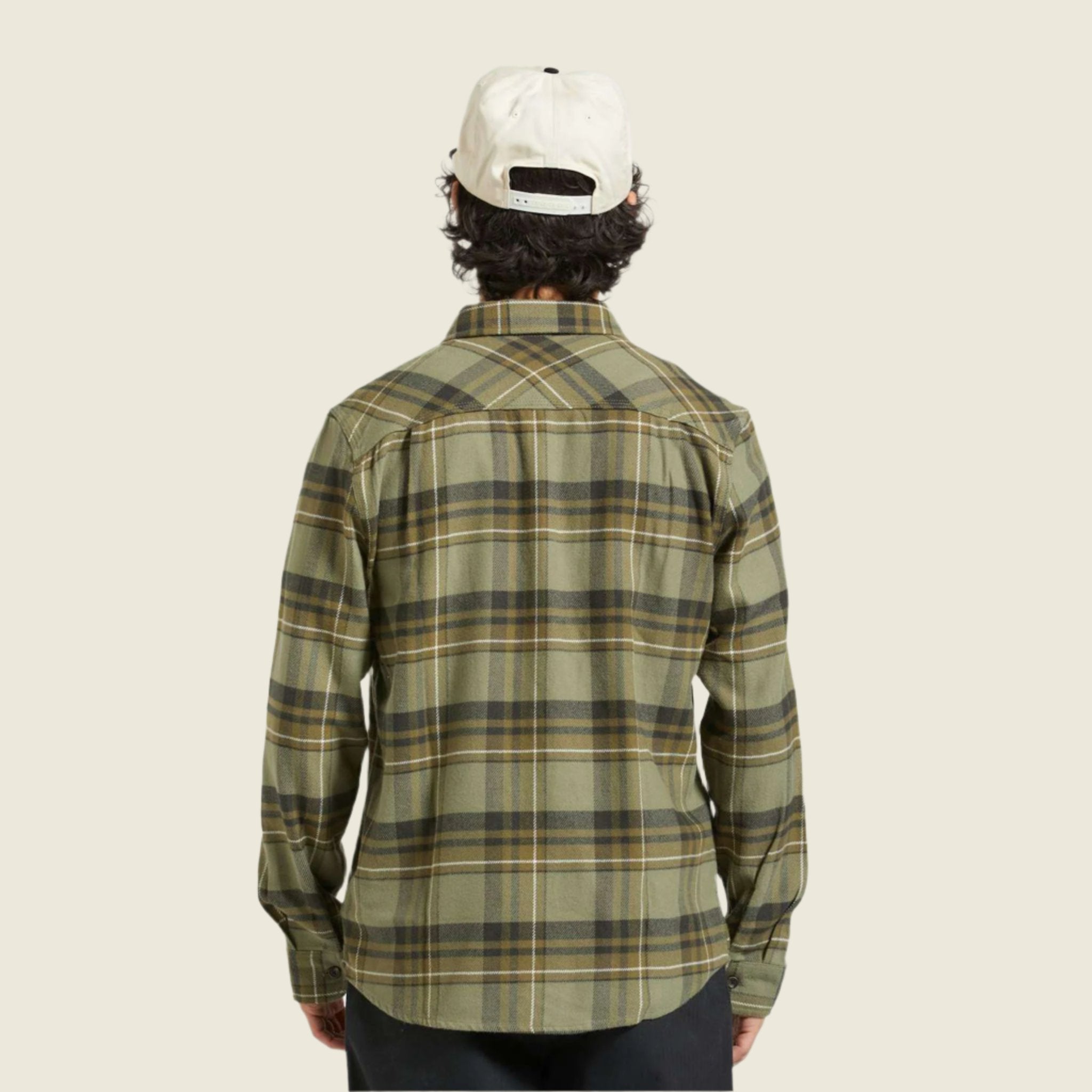 A green plaid flannel worn on a model. 