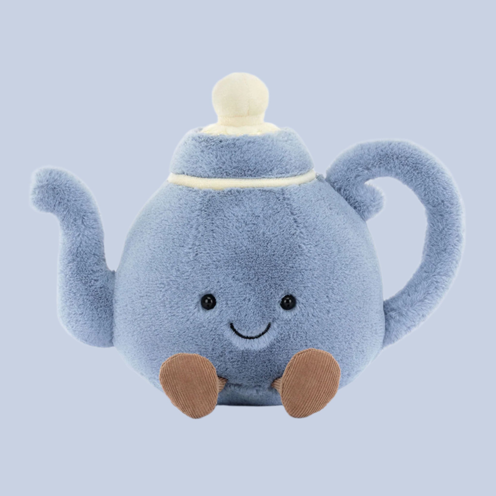 A blue teapot shaped stuffed toy with a smiling face and little legs and feet.