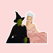 A sticker of an illustrated version of the Wicked duo Elphaba and Glinda. 