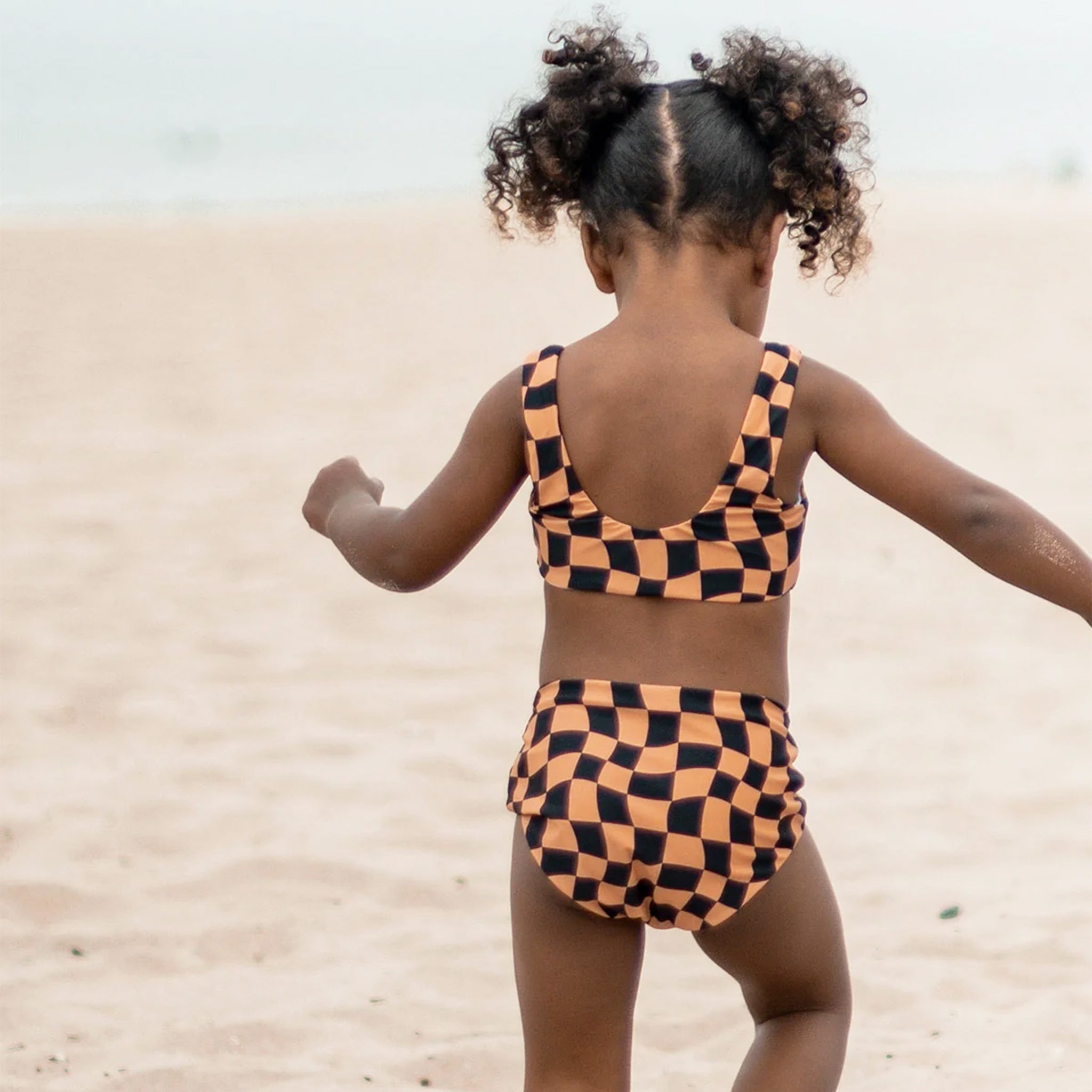 A checkered print two piece swimsuit set. 