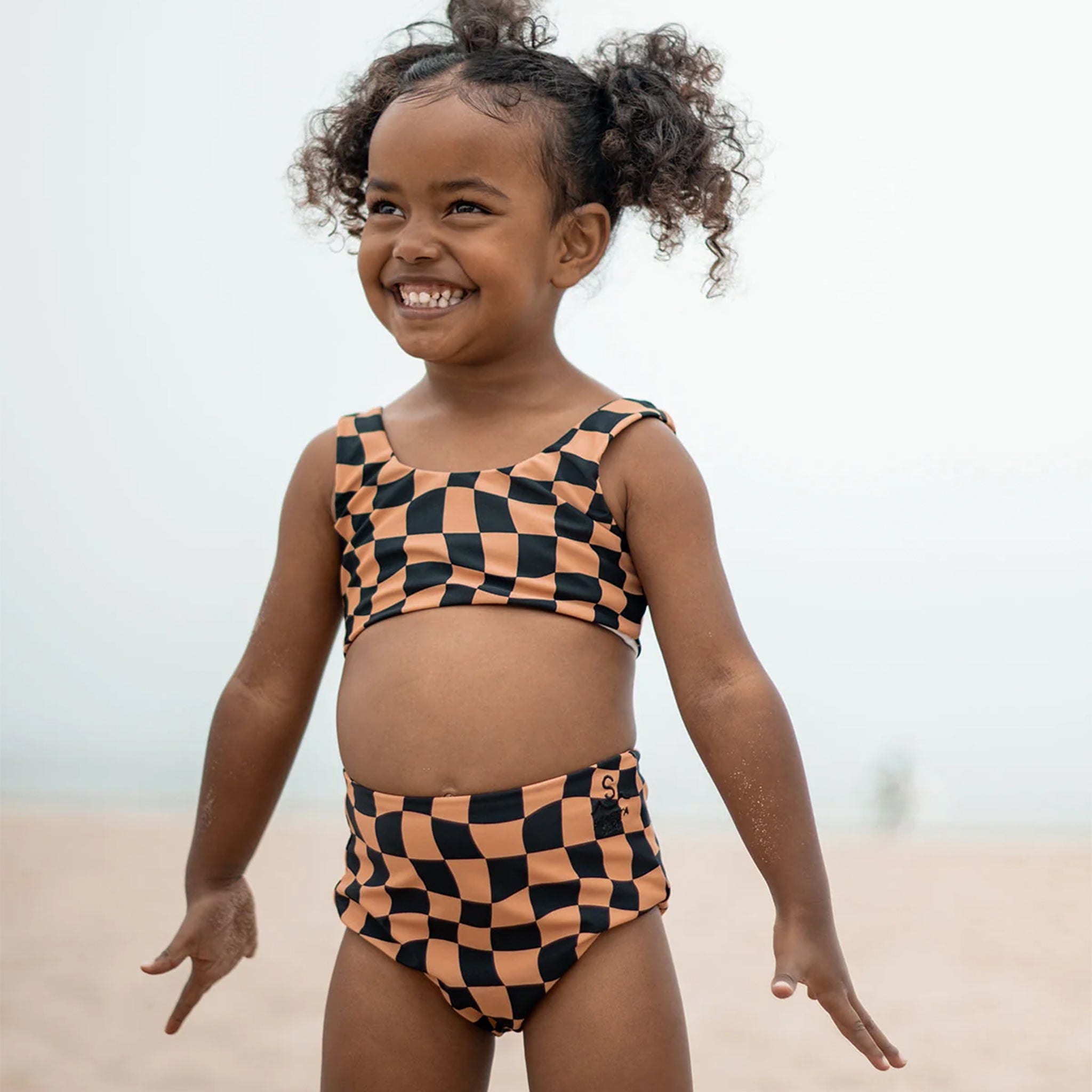 A checkered print two piece swimsuit set. 