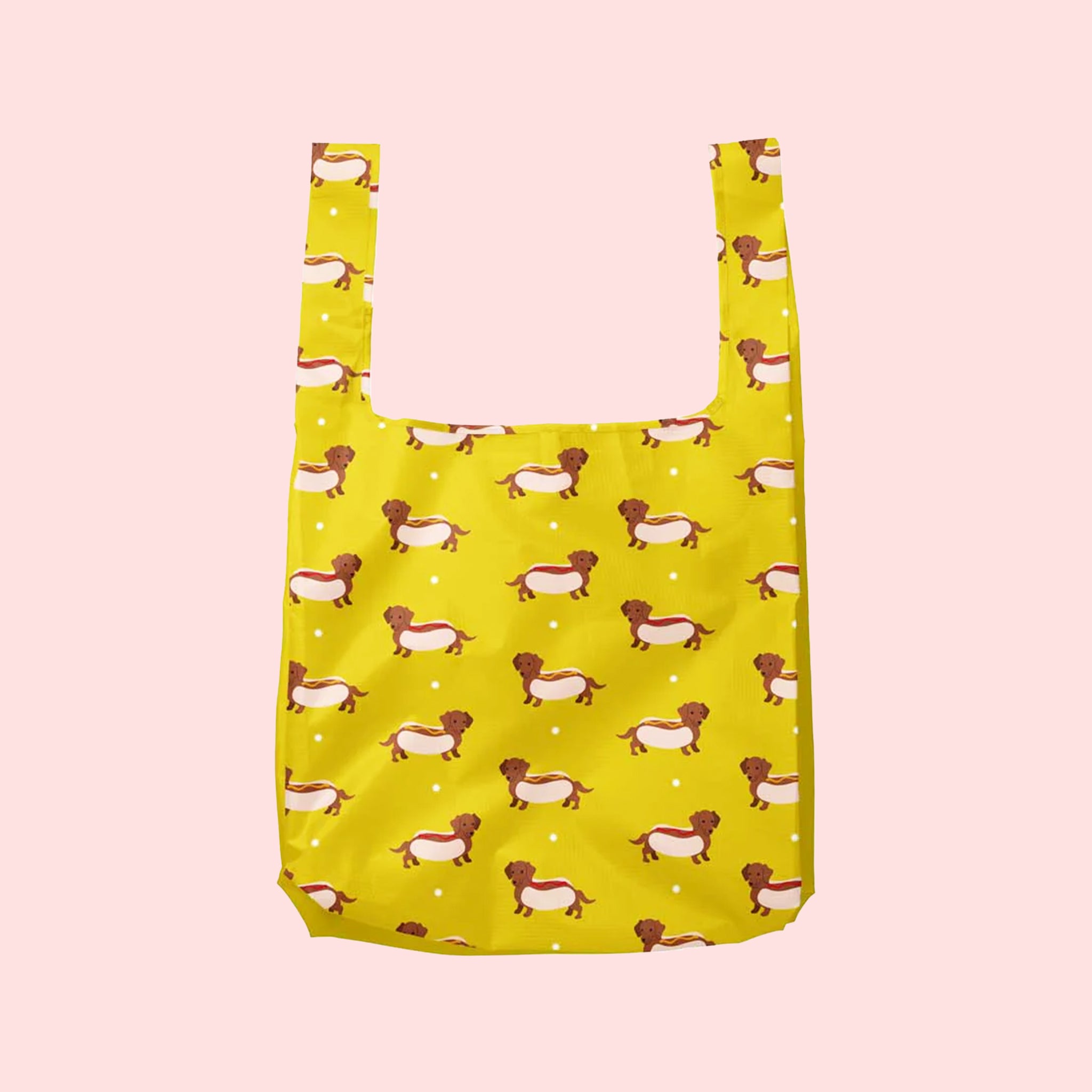 A yellow nylon tote bag with a wiener dog hot dog print.