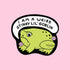 A green frog shaped sticker with a speech bubble above that reads, 'I am a weird stinky lil' goblin'.