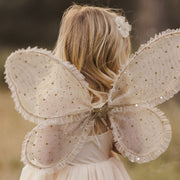 A set of champagne colored costume wings with champagne gold stars and elastic arm bands. 