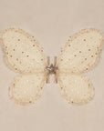 A set of champagne colored costume wings with champagne gold stars and elastic arm bands. 