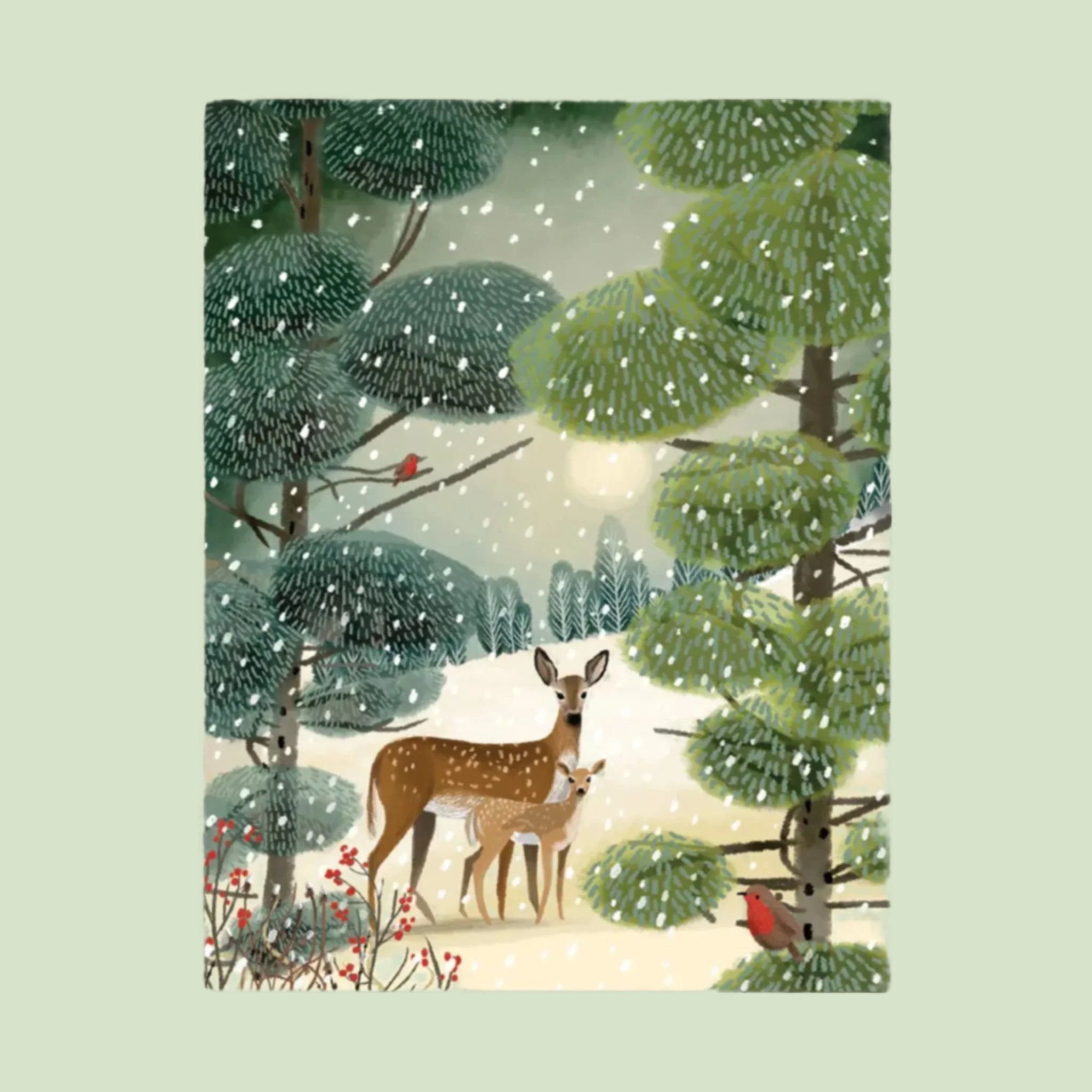 A greeting card with an illustration of two deer in a woodland backdrop. 