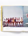 The book open to show the photographs of iconic women inside.