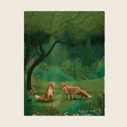 A green card with a woodland illustration with two foxes, and other woodland creatures. 