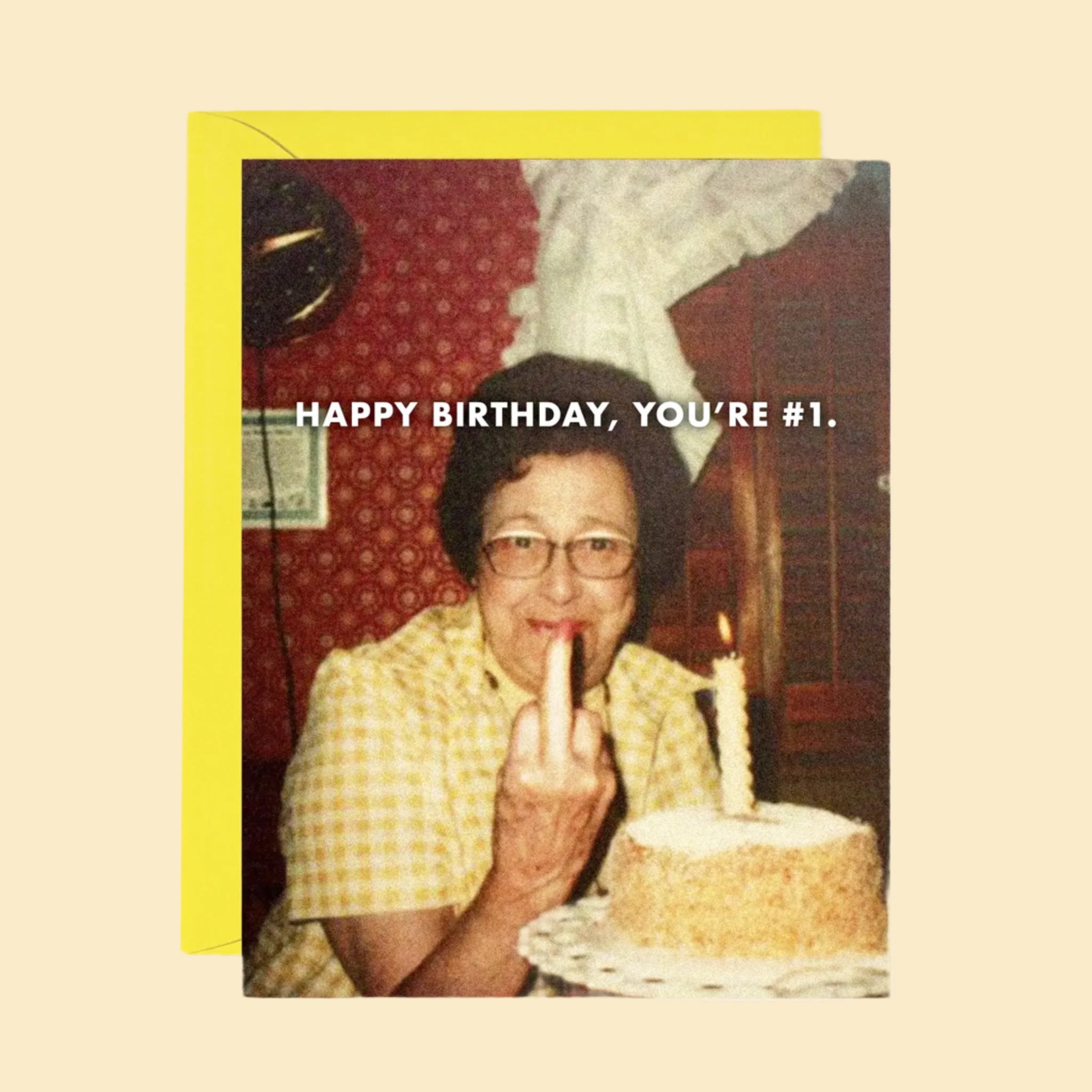 A card that reads, 'Happy Birthday, You're #1' along with vintage looking photo of a woman flipping off the camera. 