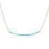 A gold chain necklace with blue turquoise beads horizontally along the chain. 