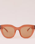 Orange sunglasses with a rounded edge and a slight cat eye shape along with orange lenses.