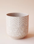 cream colored pot with chevron detail and speckles