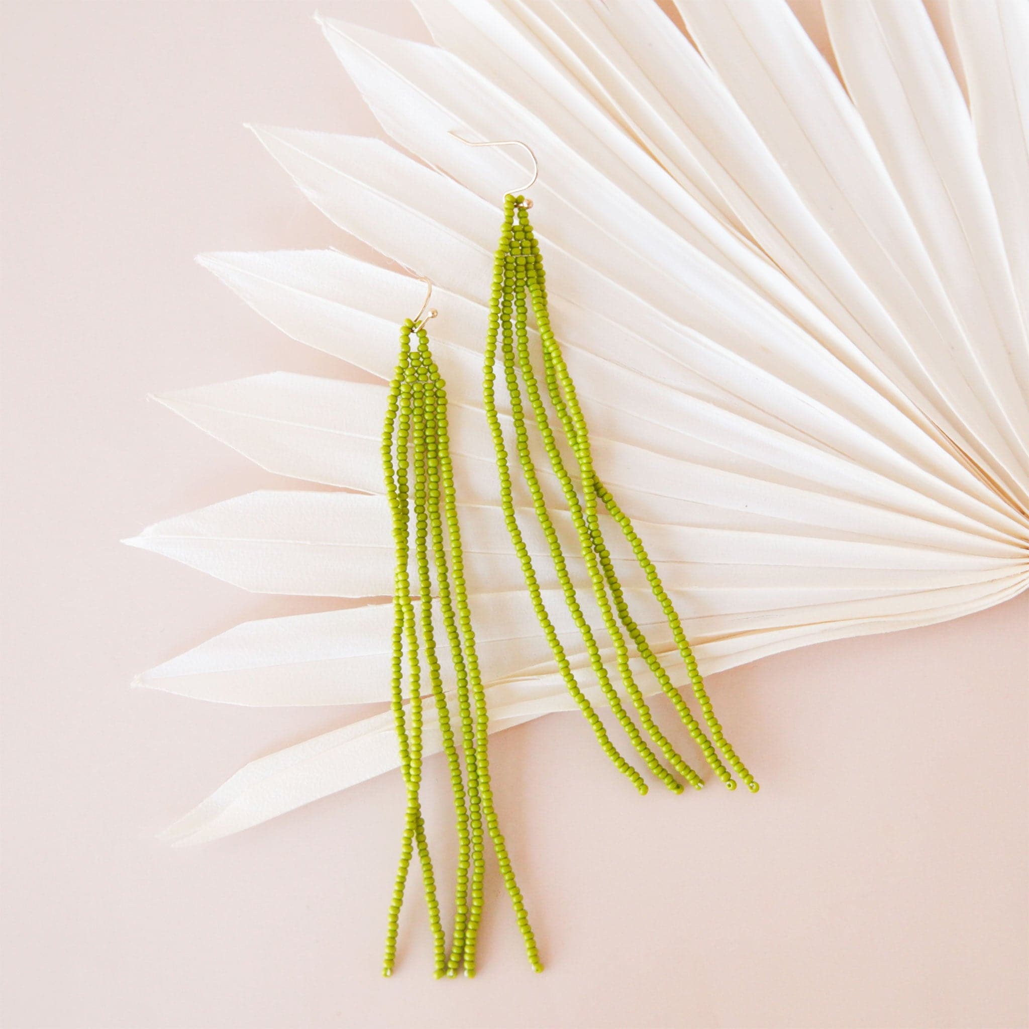 Chartreuse beaded dangly earrings with a hook backing.