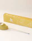A chartreuse moisture meter with a rounded head and a white meter that ranges from dry, moist, or wet along with a small oval label in the front that reads, "Jungle Club".