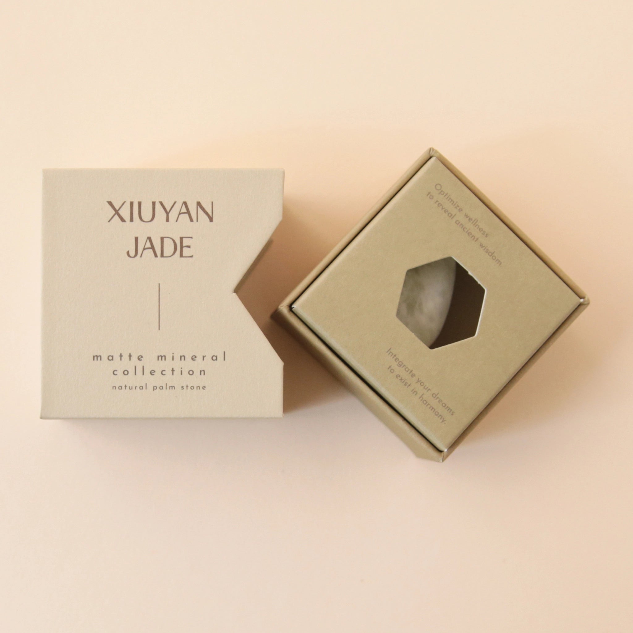 A neutral tan box that says, &quot;Xiuyan Jade Matte Mineral Collection&quot; in dark brown letters along with a white and light green Xiuyan Jade stone.