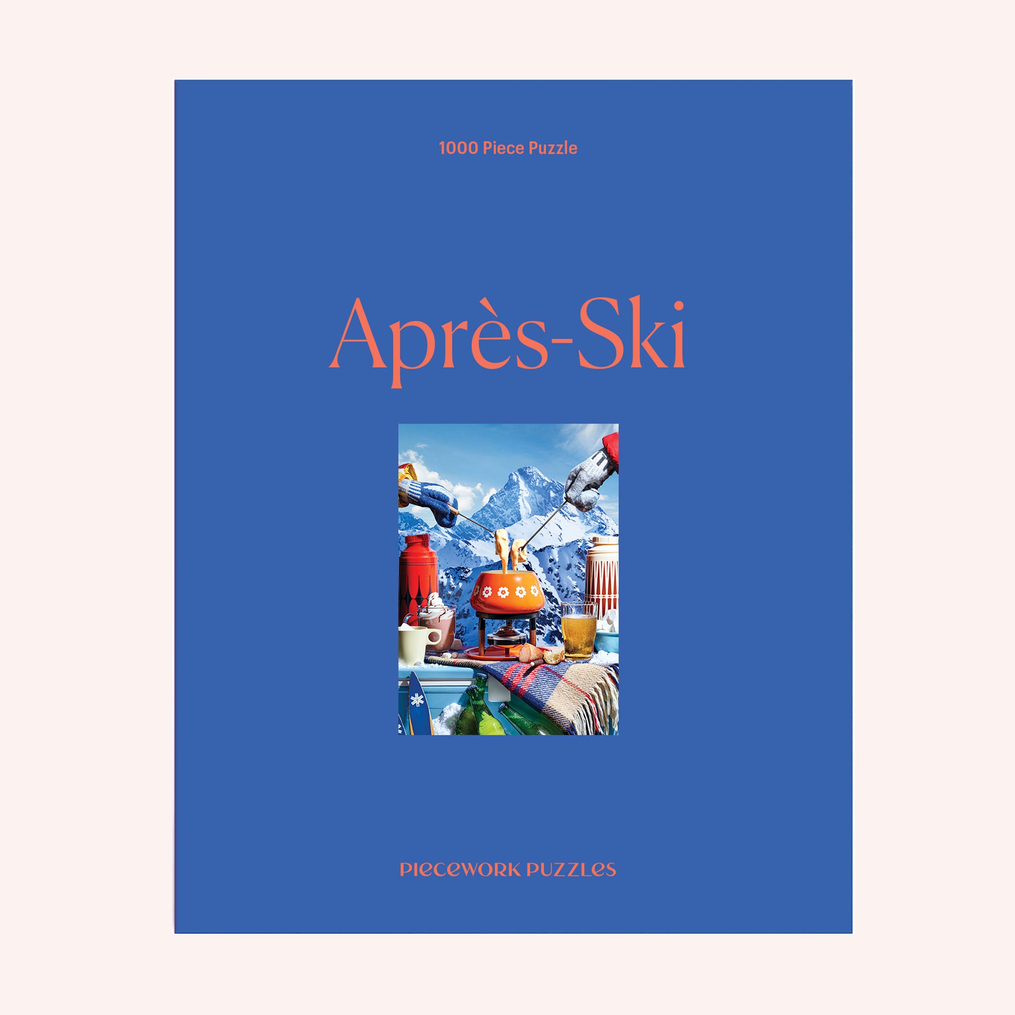 A blue boxed puzzle with light orange text that reads, &quot;Après-Ski&quot; along with an image of a vintage fondue pot and other accouterments.