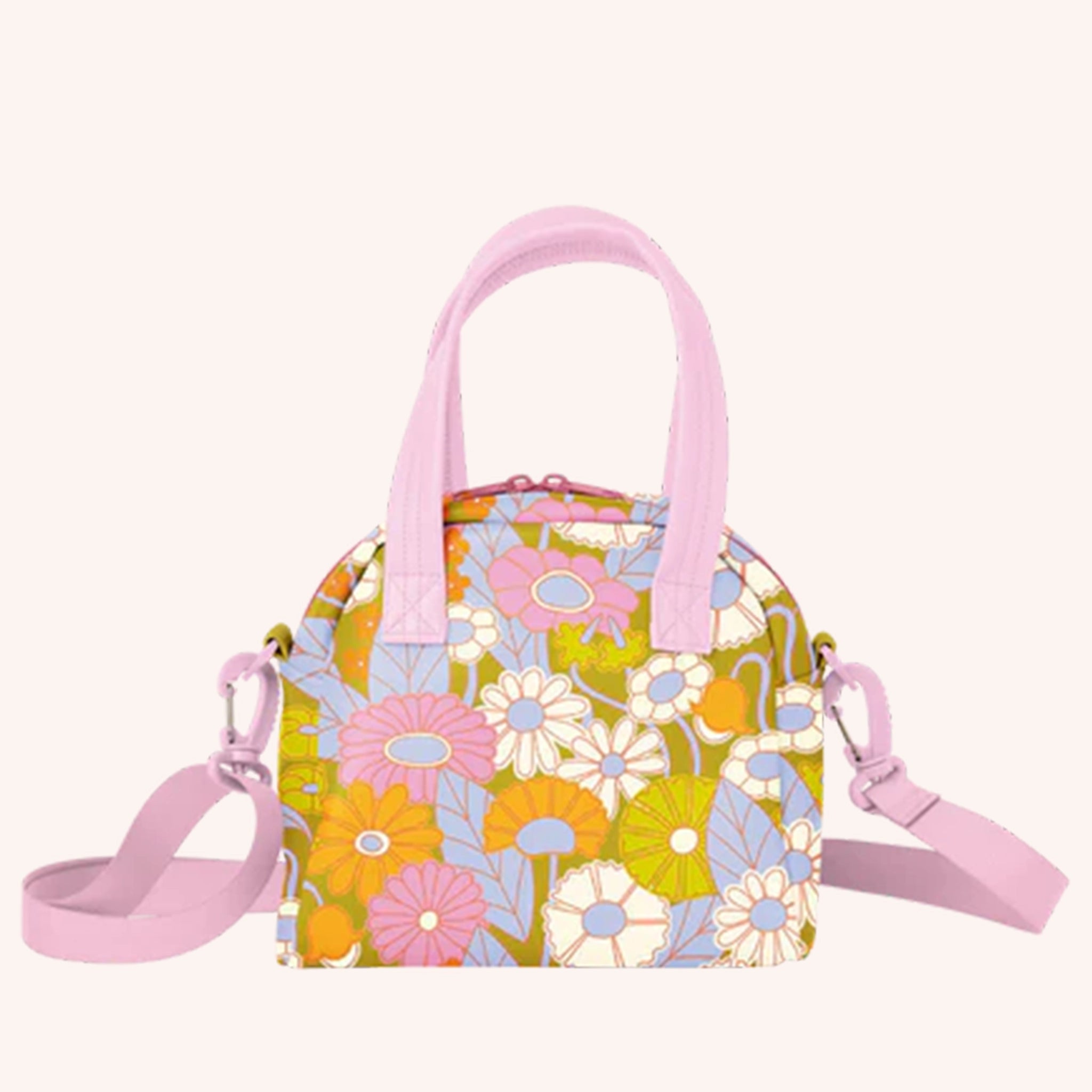 A colorful floral print hand bag with an adjustable pink shoulder strap as well as two pink, vegan leather handles.